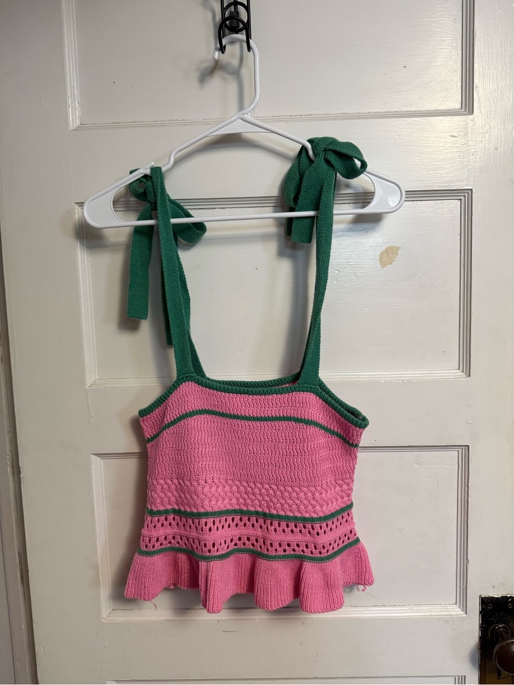 Pink and green knit crop top with ruffle hem and tie shoulder straps. Size: SM